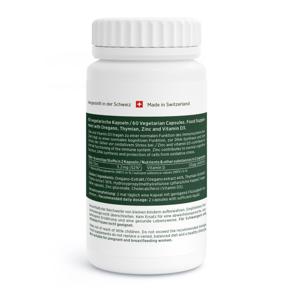Eine weiße Flasche mit grünem Etikett zeigt Oregano Vida vegetarische Kapseln mit Oregano, Thiamin, Zink und Vitamin D3. Auf dem Etikett sind Gebrauchsanweisung, Inhaltsstoffe, Warnhinweise und das Zeichen "Made in Switzerland" aufgeführt.