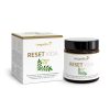 Eine weiße Schachtel und ein dunkles Glasgefäß mit der Aufschrift „Reset Vida“ zeigen Grafiken mit grünen Blättern und Blumen, Produktdetails und Markenzeichen sind in goldener und grüner Schrift dargestellt.